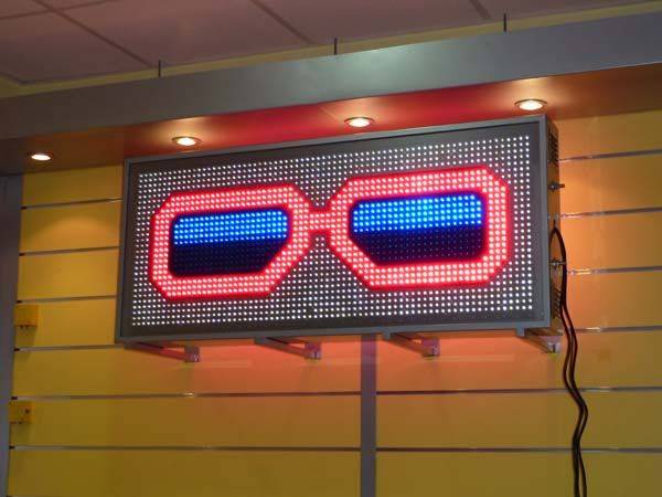 Rótulo luminoso para óptica tipo Gafas de Leds 119x54 cm. LED rojo+azul+blanco